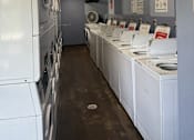 Thumbnail 8 of 21 - The Waterfront Apartments Laundry Room