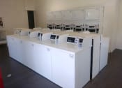 Thumbnail 6 of 22 - El Castillo Apartments laundry room