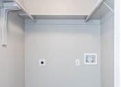 Thumbnail 34 of 41 - A small room with a white door and a white wall.