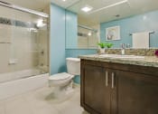 Thumbnail 9 of 23 - a bathroom with a sink toilet and a shower