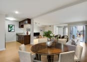 Thumbnail 14 of 23 - a living room and dining room with a table and chairs