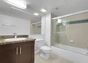 Thumbnail 45 of 53 - A bathroom with a sink, toilet, and bathtub.