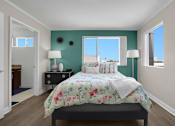 Thumbnail 38 of 53 - A bedroom with a bed, nightstands, and a window.