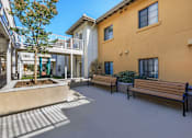 Thumbnail 8 of 11 - MacArthur Apartments courtyard and benches