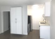 Thumbnail 10 of 12 - Millennium Apartments studio kitchen 1