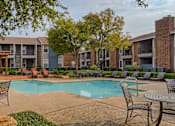 Thumbnail 8 of 15 - Oak Tree Village Apartments Pool Area and Seating