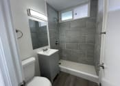 Thumbnail 15 of 27 - a small bathroom with a toilet and a sink