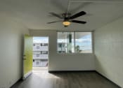 Thumbnail 16 of 27 - an empty room with a ceiling fan and a window