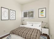 Thumbnail 6 of 13 - A bedroom with a bed, nightstand, and three framed pictures on the wall.