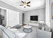 Thumbnail 2 of 13 - A living room with a grey couch, a white coffee table, and a ceiling fan.