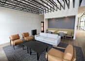 Thumbnail 14 of 36 - a large room with a couch and tables and chairs