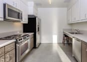 Thumbnail 16 of 25 - Pacific Pointe community kitchen
