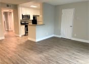 Thumbnail 9 of 18 - a kitchen Peachgrove Apartments Dining and Kitchenliving room with a wooden floor