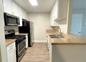 Thumbnail 4 of 18 - Peachgrove Apartments Kitchen Side View