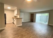 Thumbnail 5 of 18 - Peachgrove Apartments Living Room and Kitchen