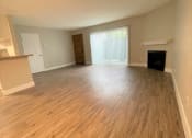 Thumbnail 6 of 18 - Peachgrove Apartments Living Room with Patio and Fireplace