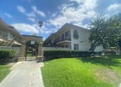 Thumbnail 3 of 7 - a house with a lawn and a driveway