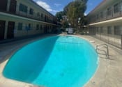 Thumbnail 5 of 7 - a large swimming pool in the middle of a building