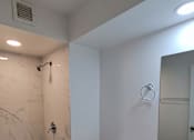 Thumbnail 12 of 22 - Punahou Circle bathroom with shower and vanity.