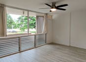 Thumbnail 4 of 22 - Punahou Circle living room with a ceiling fan.