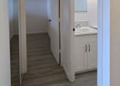 Thumbnail 19 of 22 - A bathroom with a sink and a mirror.