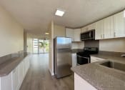 Thumbnail 1 of 18 - Punahou Heights Kitchen with Stainless Appliances