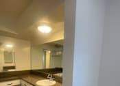Thumbnail 8 of 16 - Seaview  bathroom with a sink and mirror.