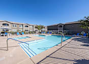 Thumbnail 12 of 19 - A large swimming pool with a blue line in the middle of it.