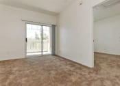 Thumbnail 13 of 15 - Sorrento Villas unfurnished living room with patio