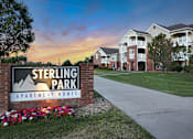 Thumbnail 1 of 33 - Sterling Park Apartment Homes sign with a sunset in the background.
