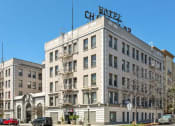Thumbnail 2 of 15 - the hotel on the corner of a city street