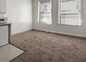 Thumbnail 8 of 15 - an empty room with two windows and a ceiling fan