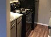 Thumbnail 14 of 24 - Trails of Walnut Creek kitchen stove, refrigerator, and cabinets