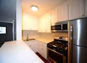 Thumbnail 7 of 18 - University Gardens kitchen countertop and appliances