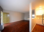 Thumbnail 6 of 18 - University Gardens unfurnished living, dining, and kitchen area