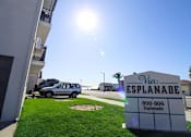Thumbnail 17 of 18 - Via Esplanade Apartments Redondo Beach Exterior Sign and Grass Area