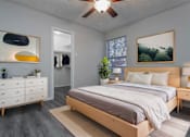 Thumbnail 13 of 20 - a bedroom with a bed and a ceiling fan
