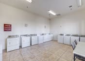 Thumbnail 10 of 21 - Whispering Palms laundry facility