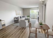 Thumbnail 12 of 39 - a living room with white walls and a wooden floor