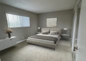 Thumbnail 8 of 39 - a bedroom with a bed and a window
