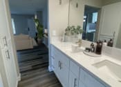 Thumbnail 6 of 39 - a bathroom with two sinks and a large mirror