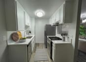 Thumbnail 4 of 39 - an empty kitchen with white cabinets and stainless steel appliances