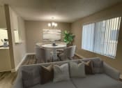 Thumbnail 3 of 39 - a living room with a couch and chairs and a table