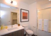 Thumbnail 4 of 27 - Yolo Apartments Bathroom Vanity, Toilet, and Shower