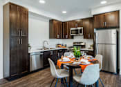 Thumbnail 2 of 28 - The Harrington dining table and kitchen with appliances