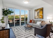 Thumbnail 1 of 28 - The Harrington furnished living area and patio