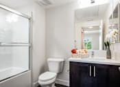 Thumbnail 14 of 28 - The Harrington bathroom vanity, toilet, and shower