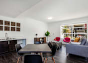 Thumbnail 15 of 28 - The Harrington dining room table and furnished living room