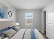 Thumbnail 9 of 14 - a bedroom with a large bed and a window