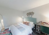 Thumbnail 14 of 24 - a bedroom with a white bed and a green headboard